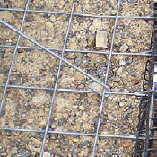 Steel formwork elements filled with small stones
