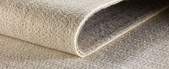 Detailed view of Tektoseal® Clay bentonite mat shows the highly swellable sodium bentonite granules and geosynthetics.