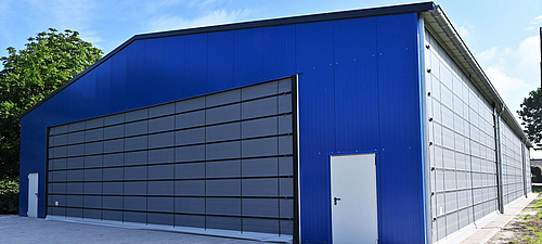 Lubratec folding front on soccer hall Large Lubratec folding door at the front of a blue soccer hall