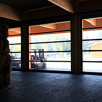 Interior view of a Lubratec Stabitor from a warehouse with straw bales