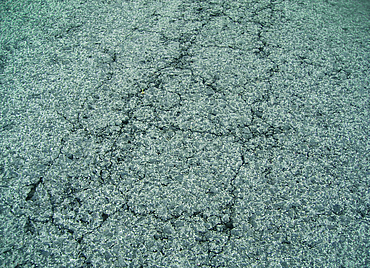 Close-up of some cracks in the tarmac surface