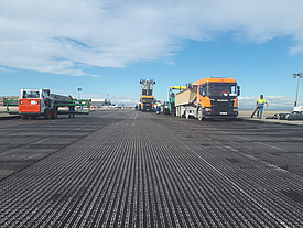 SamiGrid® composite material on airport tarmac, during asphalting