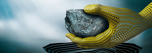 A hand holds a stone